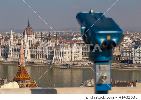 Coin operated public binoculars at Budapest. Blue telescope on observation deck 41432533