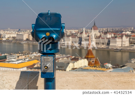Coin operated public binoculars at Budapest. Blue telescope on observation deck Coin operated public binoculars at Budapest. Blue telescope on observation deck 41432534