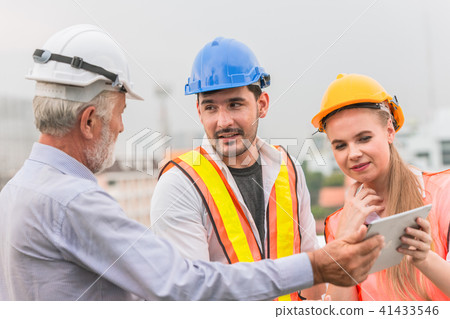 Engineer Teamwork consult together looking 41433546