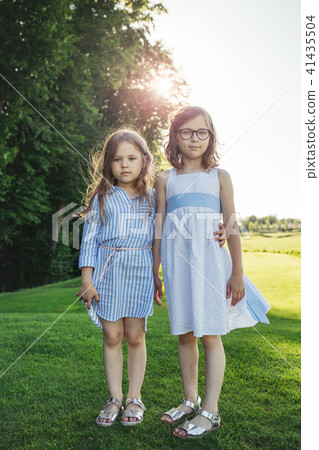 Two girls standing on the field. Two girls standing on the field. 41435504