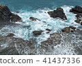 Wave on the rocks of the coastline 41437336