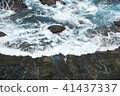 Wave on the rocks of the coastline 41437337