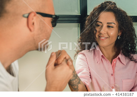 She said him yes. Closeup of young man kissing his wife hand while making marriage proposal outdoors She said him yes. Closeup of young man kissing his wife hand while making marriage proposal outdoors 41438187