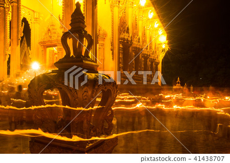 Thai people holding candles during Visakha Puja Thai people holding candles during Visakha Puja 41438707