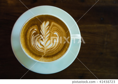 top view of Coffee cup with latte art on wooden top view of Coffee cup with latte art on wooden 41438723