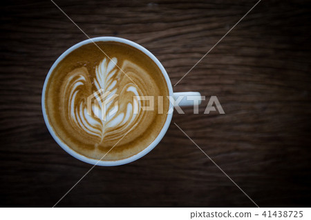 top view of Coffee cup with latte art on wooden top view of Coffee cup with latte art on wooden 41438725