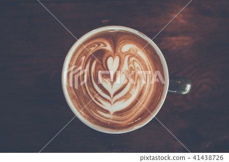 top view of Coffee cup with latte art on wooden top view of Coffee cup with latte art on wooden 41438726