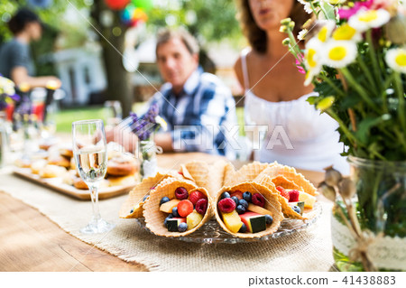 Family celebration or a garden party outside in the backyard. 41438883