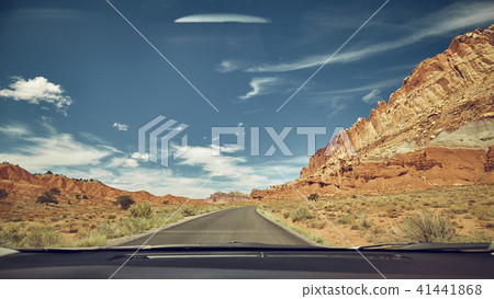 Retro toned road seen through a windshield Retro toned road seen through a windshield 41441868