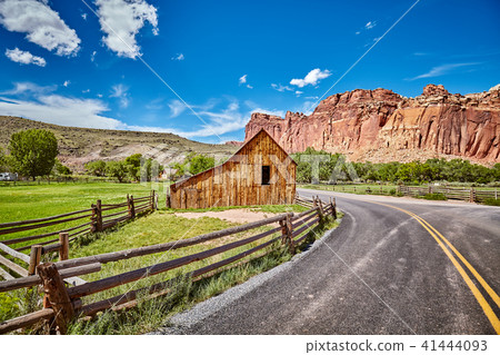 Old barn by a road. Old barn by a road. 41444093