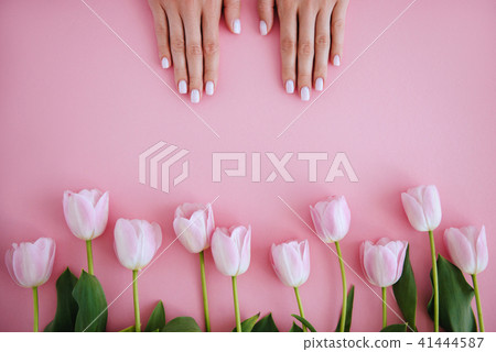 Beautiful stylish female manicure. Tulip flower. P 41444587