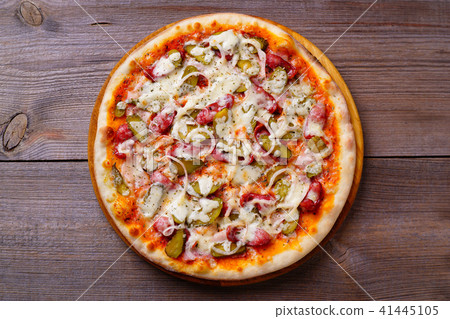 Classical napoli pizza with salami and gherkins Classical napoli pizza with salami and gherkins 41445105