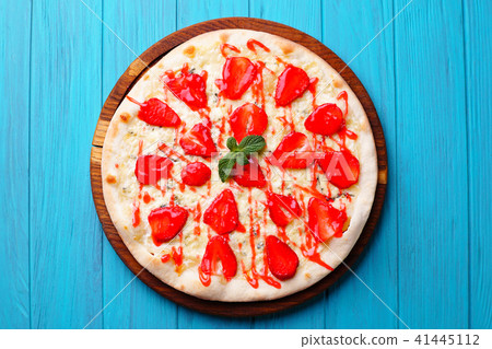 seasonal fruit strawberry pizza at blue background seasonal fruit strawberry pizza at blue background 41445112