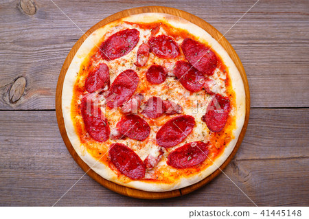 Pepperoni pizza flat lay at wood background 41445148