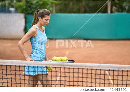 Sportive girl plays tennis 41445891