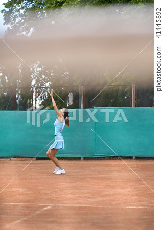 Sportive girl plays tennis Sportive girl plays tennis 41445892