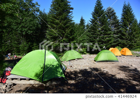 A campsite at the foot of Mt. Yatsugatake on a clear day. Tents, outdoor life, mountain climbing, trekking, camping, outdoor, solo camping A campsite at the foot of Mt. Yatsugatake on a clear day. Tents, outdoor life, mountain climbing, trekking, camping, outdoor, solo camping 41446924