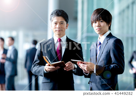 Male business image of businessman suits showing conversation 41449282