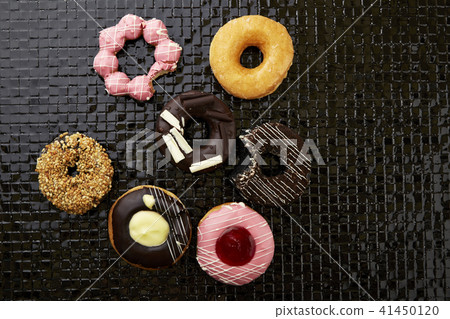 donuts with sprinkles and frosting 41450120