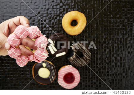 donuts with sprinkles and frosting donuts with sprinkles and frosting 41450123