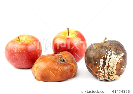 Fruits of an apple and peach with rot. 41454536
