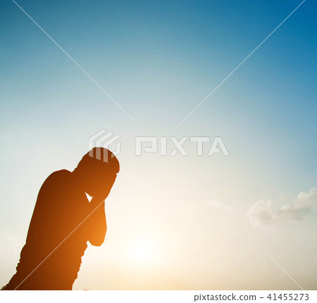 silhouette Sad or unhappy man standing below 41455273