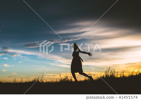 Sad woman runing at meadows try to forget bad Sad woman runing at meadows try to forget bad 41455574