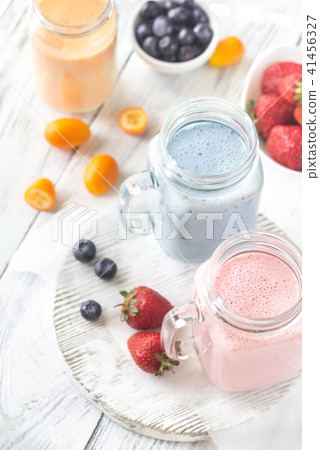 Berry smoothies on the wooden board Berry smoothies on the wooden board 41456327