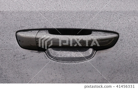 Black car door handle with dew after the  coseup 41456331