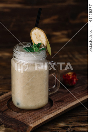 Mason jar mug with banana smoothie Mason jar mug with banana smoothie 41456877