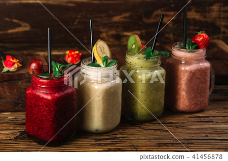 Four jar mugs with different kind of smoothie 41456878