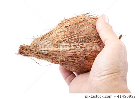 Coconut in hand isolated on white background Coconut in hand isolated on white background 41456952