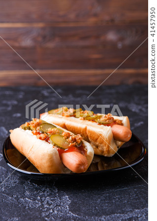 Photo of hotdogs on black plate 41457950
