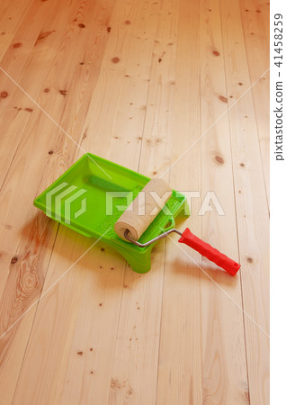 Paint roller brush on wood background Paint roller brush on wood background 41458259
