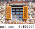 Opening windows from the house made from rocks 41459199