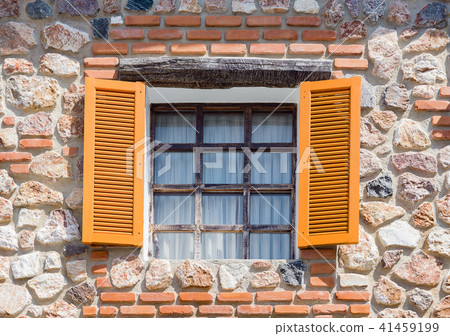 Opening windows from the house made from rocks Opening windows from the house made from rocks 41459199
