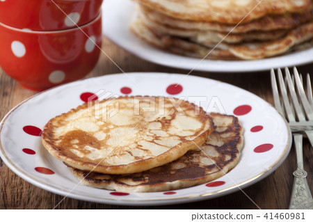 Pancakes in white plate in red peas Pancakes in white plate in red peas 41460981