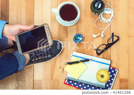 Female hand with a mobile phone and stationery Female hand with a mobile phone and stationery 41461266
