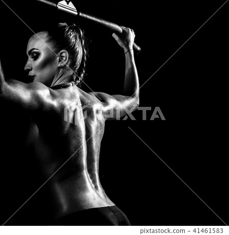 fitness woman execute exercise on black background 41461583