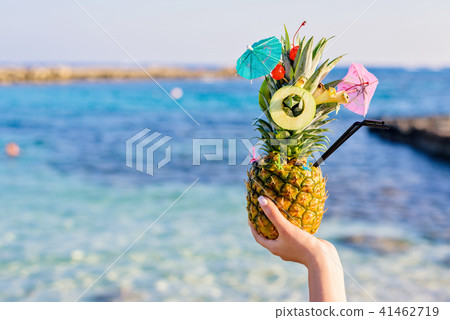 Pineapple decorated in a great exotic style Pineapple decorated in a great exotic style 41462719