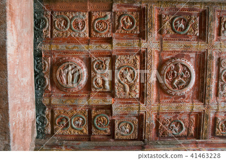 Sun god & sun signs surrounding it on the ceiling 41463228