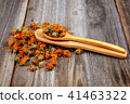 Dried calendula flowers on wooden Medicinal plants 41463322