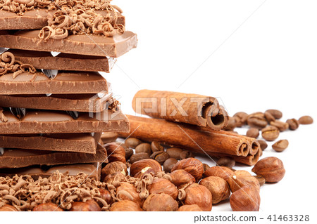Chocolate tiles and nuts on white background Chocolate tiles and nuts on white background 41463328