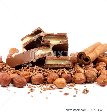 Chocolate tiles and nuts on white background Chocolate tiles and nuts on white background 41463329