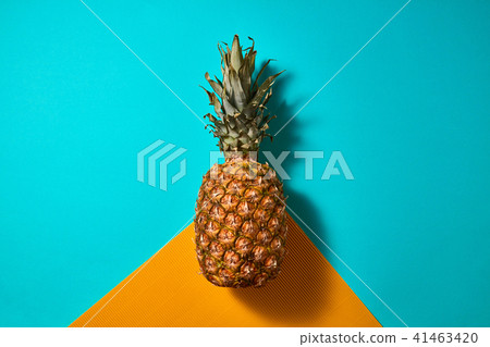 Fresh pineapple isolated on blue orange background top view 41463420