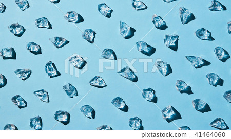 artificial transparent pieces of ice on a blue background with deep shadows artificial transparent pieces of ice on a blue background with deep shadows 41464060