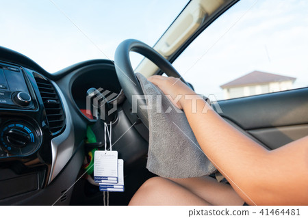 Hands of woman using microfiber fabric to clean  41464481