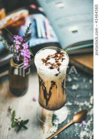 Iced mocha coffee with whipped cream in glass, wooden background 41464560