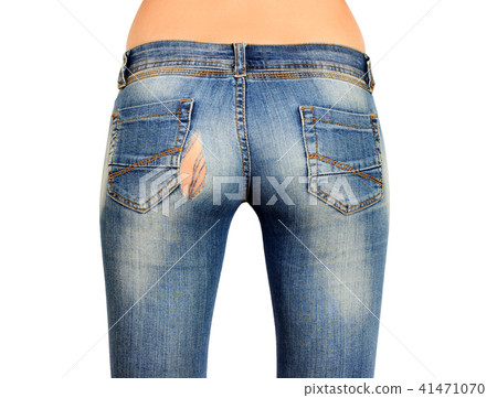 The back side of the female ass in torn blue jeans 41471070