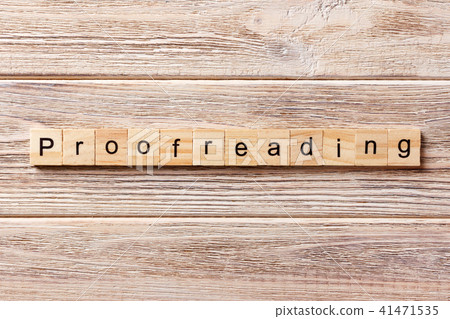 proofreading word written on wood block. proofreading word written on wood block. 41471535